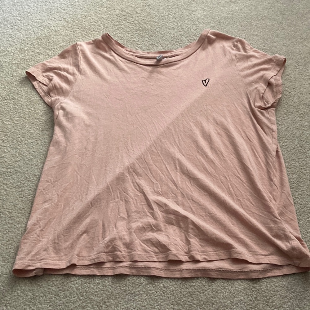 pink t-shirt with black heart design
